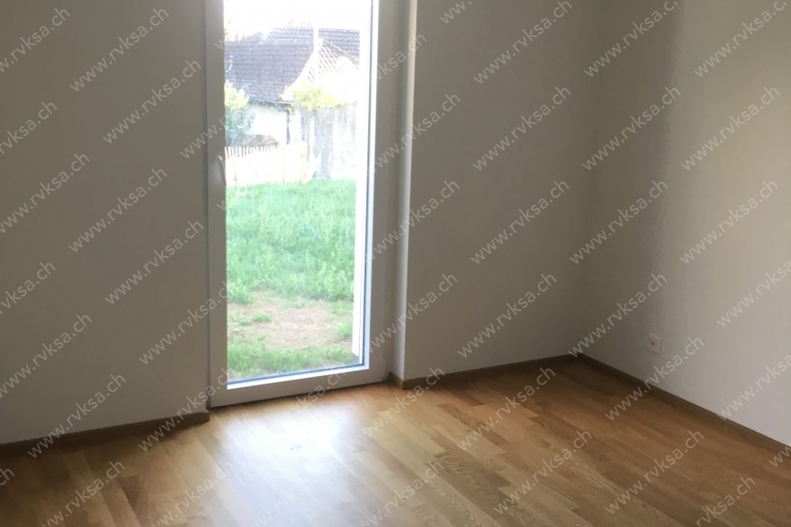 Appartement de 5 pièces, 105 m2, à Bôle - Chambre N°1 